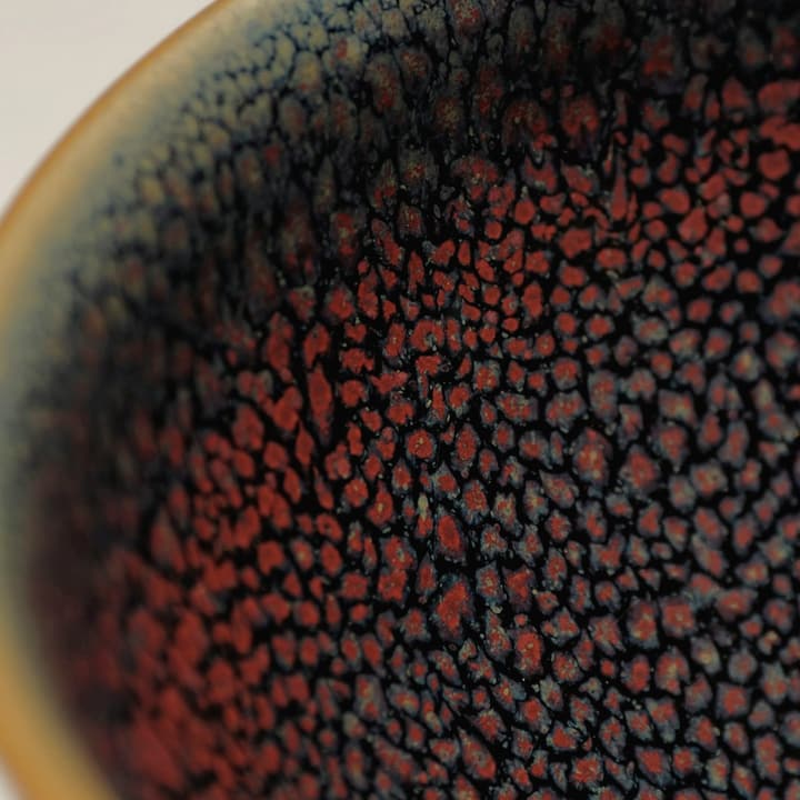 Bowl with a deep iron-brown tenmoku glaze and blue speckle, detail of the glaze